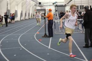 Jack Keelan runs 9:11 for 3200 at the Georgetown Prep Jesuit Invite.  Behind him Dan Santino and Andy Weber are on their way to 9:56 and 9:57 personal bests.  Photo by Steven Bugarin.